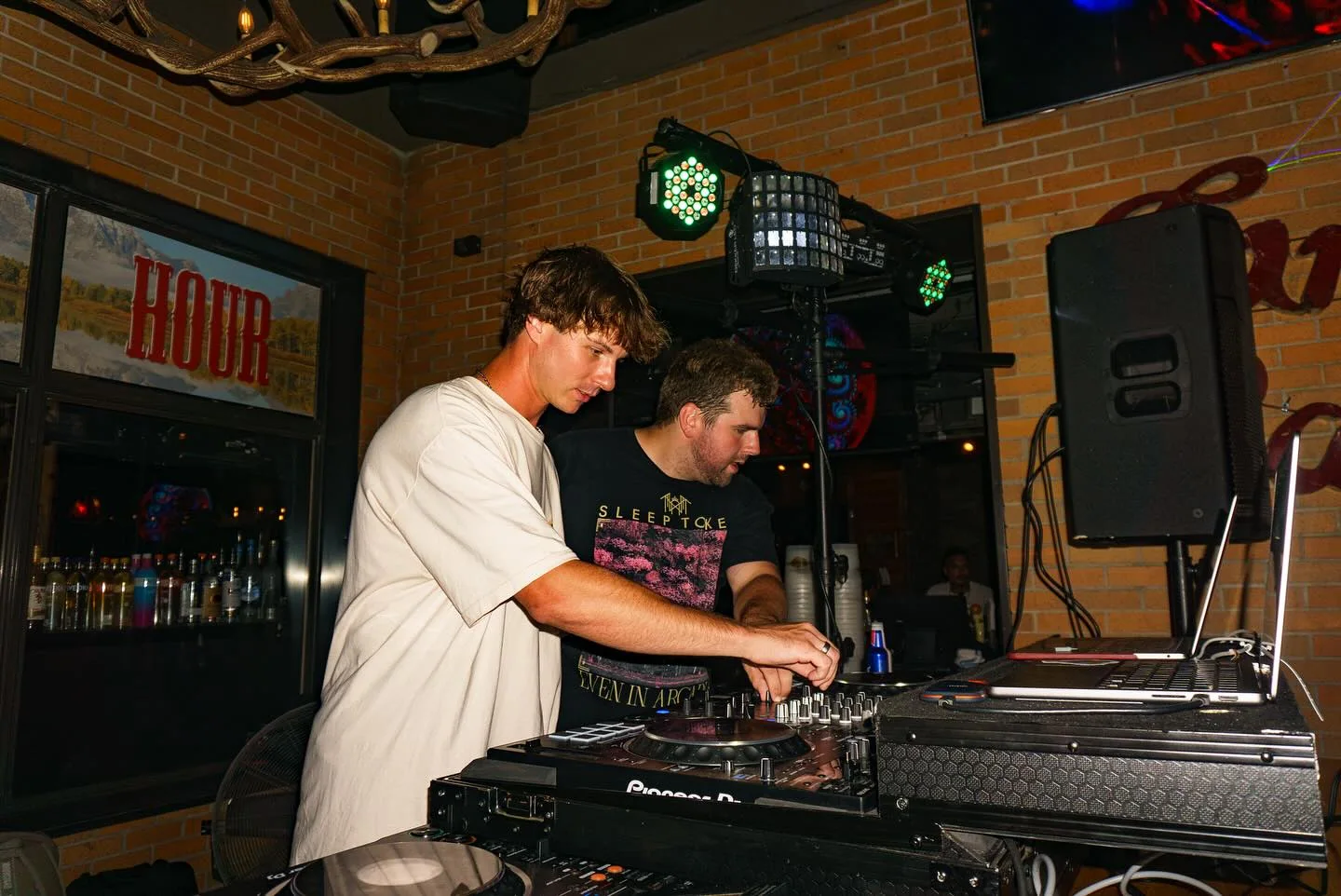 Due Dilla Gents performing side by side at the decks